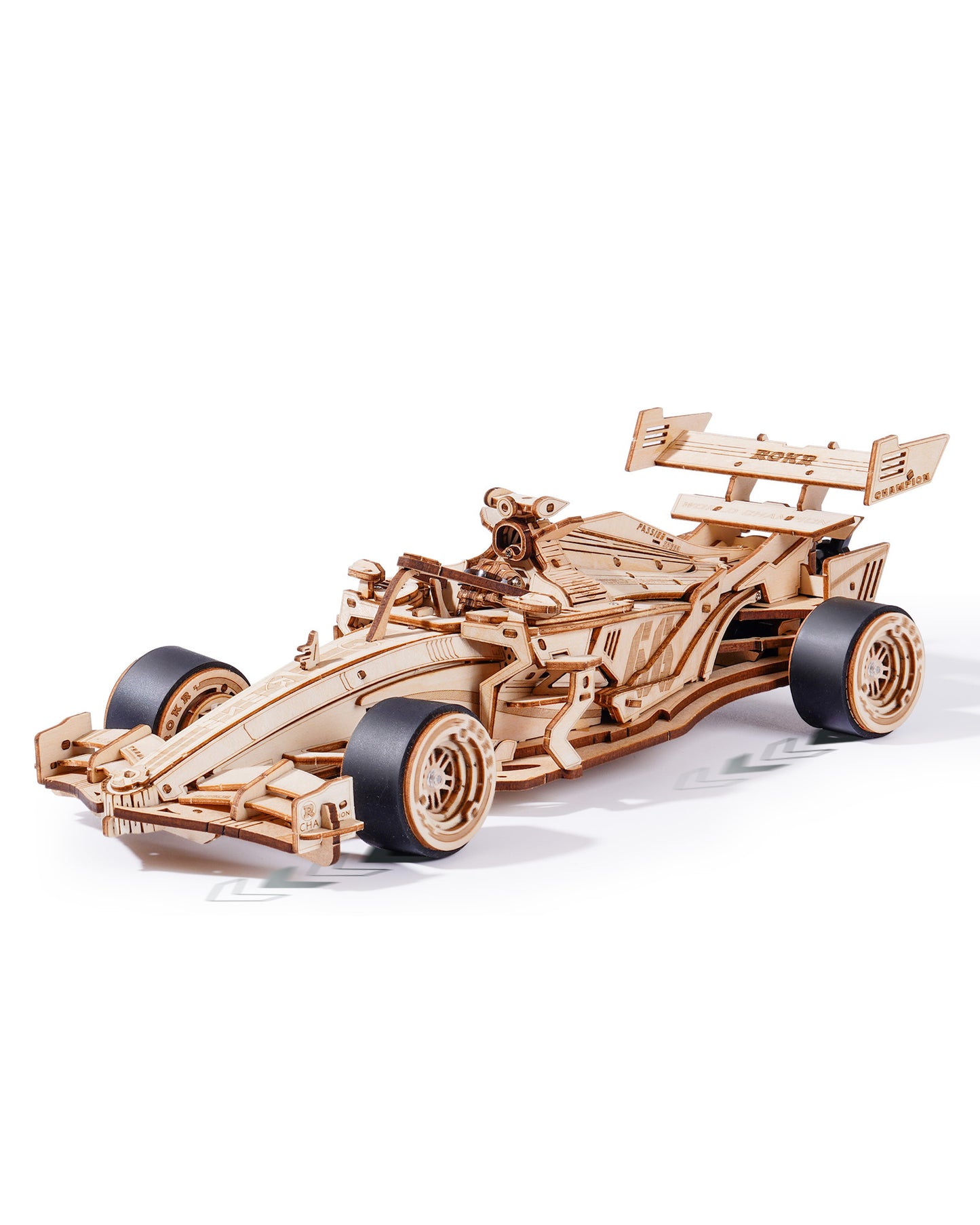 Wooden model of a Formula 1 car on a white background