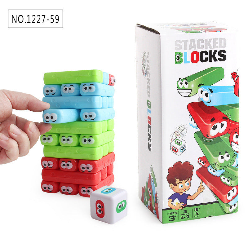 Stacked blocks toy with colorful blocks and a dice, next to its packaging.