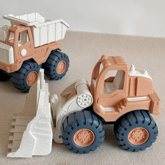 Two toy construction vehicles, a dump truck and a bulldozer, on a neutral background.