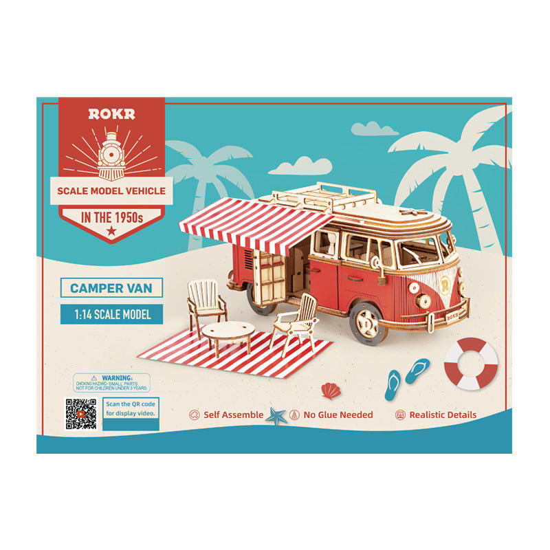 Model camper van kit packaging with ROKR branding on a beach scene background
