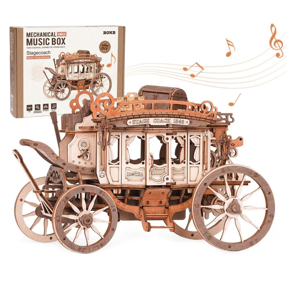 Wooden stagecoach model with mechanical music box packaging on a white background